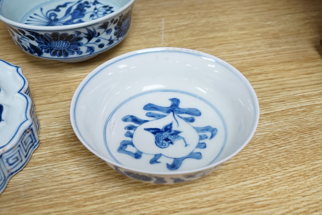 Two Chinese blue and white bowls and a lotus shaped tea pot stand, largest 15cm in diameter